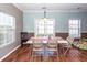 A bright dining area with wood floors features a table with seating for six and sliding glass doors to the patio at 426 Mountain Laurel Cir, Goose Creek, SC 29445