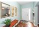 Inviting entryway with a stylish mirror, decorative art, and a functional bench, setting a welcoming tone at 426 Mountain Laurel Cir, Goose Creek, SC 29445