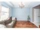 Comfortable living room featuring hardwood floors, soft lighting, and a cozy couch, perfect for relaxation at 426 Mountain Laurel Cir, Goose Creek, SC 29445
