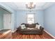 Serene living room showcasing hardwood floors, natural light from the window, and a comfortable couch at 426 Mountain Laurel Cir, Goose Creek, SC 29445