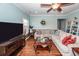 Comfortable living room with hardwood floors, a sectional sofa, and a media center, ideal for entertainment at 426 Mountain Laurel Cir, Goose Creek, SC 29445