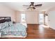 Large main bedroom with hardwood floors, a ceiling fan, and two bright windows at 426 Mountain Laurel Cir, Goose Creek, SC 29445