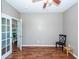 Office with hardwood floors, neutral paint and glass doors at 426 Mountain Laurel Cir, Goose Creek, SC 29445
