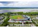 Aerial view of a baseball field in the city, with a river and surrounding trees at 5 Maranda Holmes St, Charleston, SC 29403