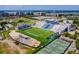 Aerial view of a stadium featuring a football field, tennis courts, and parking at 5 Maranda Holmes St, Charleston, SC 29403