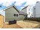 View of backyard with green siding and new sod at 5 Maranda Holmes St, Charleston, SC 29403