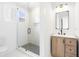 Bright bathroom featuring a glass enclosed shower, modern vanity, and rectangular mirror at 5 Maranda Holmes St, Charleston, SC 29403