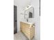 Stylish bathroom features a modern vanity with a unique wood-slat design and a decorative mirror at 5 Maranda Holmes St, Charleston, SC 29403