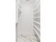 Walk-in closet with white shelving and marble-look flooring at 5 Maranda Holmes St, Charleston, SC 29403
