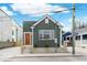 Charming home features a tidy, dark green exterior, a quaint front yard and modern design at 5 Maranda Holmes St, Charleston, SC 29403