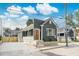 Charming home features a tidy, dark green exterior, a quaint front yard and modern design at 5 Maranda Holmes St, Charleston, SC 29403