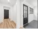 Bright hallway leads to a room with large windows at 5 Maranda Holmes St, Charleston, SC 29403