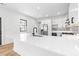 Bright kitchen showcasing a large quartz countertop island, stainless steel appliances, and modern design at 5 Maranda Holmes St, Charleston, SC 29403