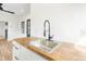A contemporary kitchen featuring wood countertops and modern hardware, creating a chef-friendly space at 5 Maranda Holmes St, Charleston, SC 29403