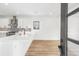 Modern kitchen boasts white cabinets, stainless steel appliances, and a stylish backsplash at 5 Maranda Holmes St, Charleston, SC 29403