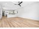 Bright open-concept living room and kitchen featuring hardwood floors and contemporary design at 5 Maranda Holmes St, Charleston, SC 29403