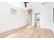 Bright living room featuring a decorative brick pillar and light wood floors, creating a warm and inviting space at 5 Maranda Holmes St, Charleston, SC 29403