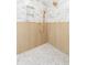 Close up of a large shower with beautiful tiling, gold hardware and a niche for storage at 5 Maranda Holmes St, Charleston, SC 29403