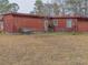 Fenced yard with trees and view of the back of a wood sided home at 609 Levee Dr, Moncks Corner, SC 29461