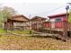 Exterior of home featuring covered patios with weathered wood, next to the fallen tree branch in yard at 609 Levee Dr, Moncks Corner, SC 29461