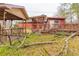Exterior of home featuring covered patios with weathered wood, next to the fallen tree branch in yard at 609 Levee Dr, Moncks Corner, SC 29461