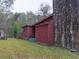 Rustic home exterior with stone chimney, siding, and trees at 609 Levee Dr, Moncks Corner, SC 29461