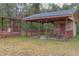 Outdoor view of backyard covered patio featuring tables and a relaxing space at 609 Levee Dr, Moncks Corner, SC 29461