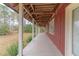 Spacious covered porch offering outdoor living and natural views at 609 Levee Dr, Moncks Corner, SC 29461
