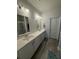 Modern bathroom features double sinks, a large mirror, and a shower with glass door at 618 Hilchot Dr, Summerville, SC 29486