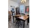 Cozy dining area with hardwood table, stylish chairs, and natural light from the window at 618 Hilchot Dr, Summerville, SC 29486