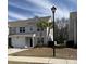 Charming home with gray siding, well-manicured lawn, and palm trees in the front yard at 618 Hilchot Dr, Summerville, SC 29486
