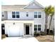 Charming two-story home with a garage, a black front door, and beautiful palm trees at 618 Hilchot Dr, Summerville, SC 29486