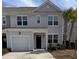 Charming two-story home with a garage, inviting entrance, and mature landscaping at 618 Hilchot Dr, Summerville, SC 29486