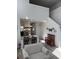 Bright living room with vaulted ceilings, open staircase, and view of a modern kitchen at 618 Hilchot Dr, Summerville, SC 29486