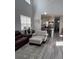 Open-concept living space with great natural light and an adjacent modern kitchen with bar seating at 618 Hilchot Dr, Summerville, SC 29486