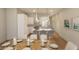 Bright kitchen with a view of the dining area, stainless steel appliances and tile backsplash at 7626 Indigo Palms Way, Johns Island, SC 29455