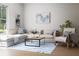 Cozy living room with a large window, comfortable sectional sofa and blue striped rug at 7626 Indigo Palms Way, Johns Island, SC 29455