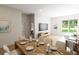Open-concept living space showcasing the dining area, living room with a view of the backyard at 7626 Indigo Palms Way, Johns Island, SC 29455