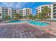 Large, inviting community pool with brick patio and plenty of lounge chairs for residents at 8000 Palmetto Dr # 506, Isle of Palms, SC 29451