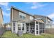 Exterior view of home featuring a screened porch, siding, and well-maintained yard at 9009 Cat Tail Pond Rd, Summerville, SC 29485