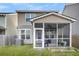 Exterior view of home with screened porch, siding, and backyard landscaping at 9009 Cat Tail Pond Rd, Summerville, SC 29485