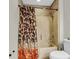 Bathroom featuring a shower-tub combination with tiled walls and a decorative shower curtain at 9009 Cat Tail Pond Rd, Summerville, SC 29485