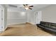 Bonus room includes a sofa, ceiling fan, and extra natural light at 9009 Cat Tail Pond Rd, Summerville, SC 29485