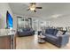 Inviting living room with ample natural light and modern ceiling fan at 9009 Cat Tail Pond Rd, Summerville, SC 29485