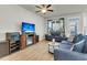 Comfortable living room featuring a fireplace and entertainment center at 9009 Cat Tail Pond Rd, Summerville, SC 29485
