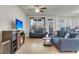 Comfortable living area with hardwood floors, neutral walls, and bright light at 9009 Cat Tail Pond Rd, Summerville, SC 29485