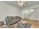 Inviting living room boasts hardwood floors, neutral walls, and a staircase at 9009 Cat Tail Pond Rd, Summerville, SC 29485