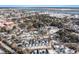 Community aerial view showcasing charming homes near waterfront with a view of the Ravenel Bridge and shipping port at 1002 Carmela Ct, North Charleston, SC 29405