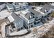 Overhead shot of neighborhood homes with snow covered lawns and dark rooftops at 1002 Carmela Ct, North Charleston, SC 29405