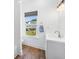 Bright bathroom features a white vanity and a window offering natural light and views at 1002 Carmela Ct, North Charleston, SC 29405